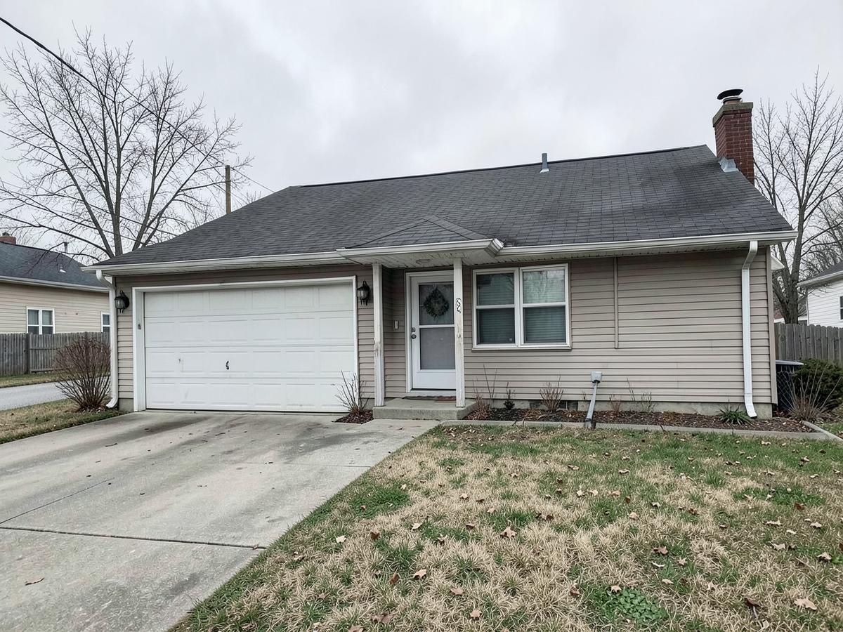 Vacant suburban home with an attached two-car garage